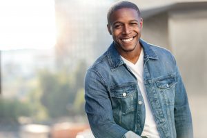 handsome black man modeling showing off attractive smile